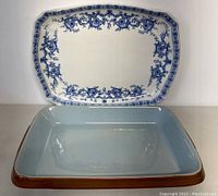 Front view of both serving dishes, the blue and white Ridgways platter positioned behind the brown and blue Denby dish.