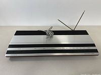 Front view of Bang & Olufsen Beomaster 1900 Model 2904 stereo receiver with visible control buttons and antennas.