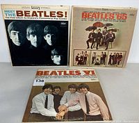 Photo showing three Beatles vinyl albums with front covers visible: Meet The Beatles!, Beatles '65, and Beatles VI.