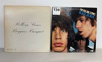 Front covers of two Rolling Stones vinyl albums: Beggars Banquet on left, Black and Blue on right