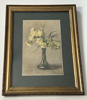 Full front view of framed watercolour painting depicting yellow flowers in a vase