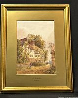 Full view of framed watercolour painting showing landscape with traditional timber-framed house, people, and carriage