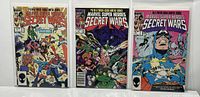 Front view of Marvel Super Heroes Secret Wars issues #5, 6, and 7 in protective sleeves showing cover art and condition.