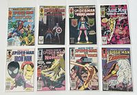 Eight Marvel Team-Up Spider-Man comic books arranged flat and bagged, showing front covers.