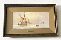 Full view of the framed watercolor depicting two sailboats in a misty coastal scene, with a beige mat and nameplate reading 'W. Stewart'.