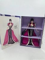 Brunette Brilliance Barbie in original box with purple interior and design card insert showing outfit sketch.