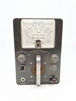 Front view of Heathkit Model RC-1 Radiation Counter showing full face with analog meter, control knobs, calibration switch, handle, and input jack.