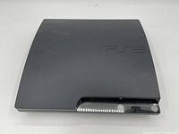 Top view of Sony PS3 slim console showing the PS3 logo and general condition.
