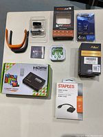 Overview of all electronic accessories on a light surface