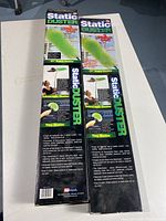Two boxes of Static Duster 3 Piece Set showing front and back packaging with item details and branding.