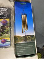 Box of Nature's Symphony Premier Chime wind chimes showing packaging with product details.
