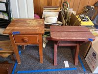 Photo of two wooden side tables, one with single dovetail drawer and one painted red without drawer, showing general condition and details.