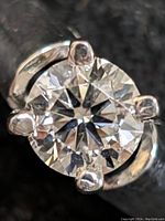 Close-up top view of round brilliant diamond in four-prong setting