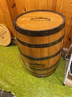 Full-height view of barrel showing metal hoops and side branding