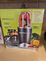 Photo of the Nutribullet box showing product image, 12-piece set included, and 600 watt motor power.