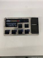 Top-down view of the Digitech RP2000 guitar effect pedal showing the digital display, footswitch buttons labeled 1 to 4, compressor, amp channel sections, and expression pedal.