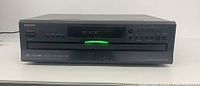 Front view of Onkyo CD changer powered on showing 'NO DISC' on display and illuminated tray indicator.
