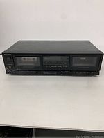 Front view of the Sony stereo cassette deck with a cassette inserted in the left compartment showing power and headphone jack controls