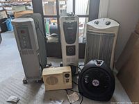 Photo showing all five heaters of various brands and styles together.