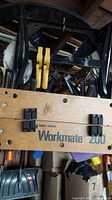 View of wooden top of Black & Decker Workmate 200 with logo and clamping handles visible