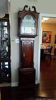Full front view of entire grandfather clock