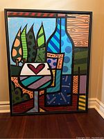 Frontal view of the framed canvas print showing full colorful design