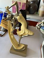 Full view of the dancing woman acrylic sculpture in profile.