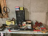 Wide view of lot including metal organizer with drawers, pipe wrench, boxed tap and die sets, metal service box, and assorted hand tools on table