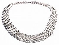Top down image showing the full shape and arrangement of the multi-strand silver-tone vintage necklace.