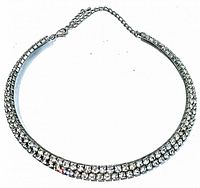 Front view of vintage rhinestone choker necklace showing the double row of clear rhinestones set in silver-tone metal with lobster claw clasp and extension chain.