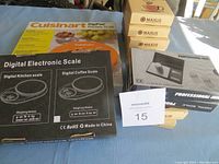 Overview of all digital scale boxes including MAXUS and Cuisinart DigiPad Kitchen Scales.