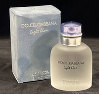 Frontal image of the Light Blue Dolce & Gabbana Eau De Toilette box and bottle showing branding and size.