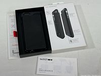 Black EVO Endurance lithium battery charging case for iPhone 6 in original box with instruction manual and product packaging.