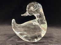 Side profile view of the clear Murano glass duck showing overall shape and size.