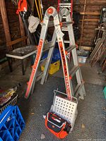 Multi-position ladder set up in A-frame configuration with attachments
