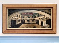 Full view of the framed oil painting showing the entire courtyard scene and frame.
