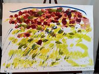 Front view of the painting showing vibrant red and burgundy flowers above yellow and green foliage, signed Van Klavenen 1984 at bottom right with inscription at bottom left.