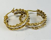 Pair of braided gold hoops front view