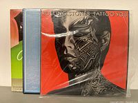 Front cover of Rolling Stones Tattoo You album with face tattoo artwork