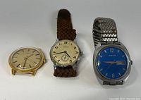 Three men's wristwatches displayed side by side on a white background, showing Jubilee, Timex, and Nose1A watches. The Timex watch is without a band.