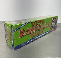 Side angle of sealed green and blue box showing 'Topps Baseball Cards' and '792 Picture Cards'