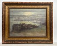 Framed photolithograph of a seascape with rocky shore and cloudy sky, signed by George Horne Russell.