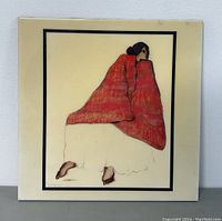 Front view of ceramic tile plaque with seated woman artwork and red shawl by R.C. Gorman