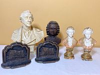 Wide shot showing all items in the lot including busts and bookends
