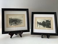 View of two framed black and white photographs on stands showing Peggy's Cove scenes