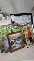 Overall group photo showing 5 framed artworks including a seascape, peacock, child with dog, and other landscapes.