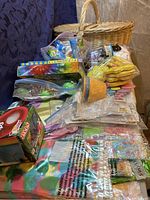 Photo of large woven basket filled with plastic eggs, dyeing kits, stickers, and other assorted Easter items