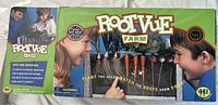 Front of box showing Root-Vue Farm logo, children observing roots, and promotional text about the kit.