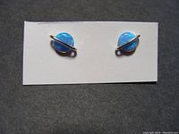 Pair of round blue-green opals set in sterling silver studs on white card