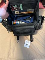 Open carrying case showing Sony Digital8 Handycam camcorder inside with battery attached and shoulder strap.